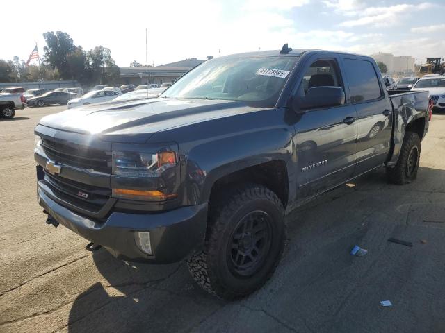 CHEVROLET SILVERADO 2017 with VIN 3GCUKREC4HG186684 - Photo from auction