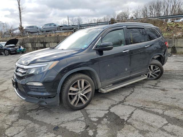 HONDA PILOT TOUR 2017 with VIN 5FNYF6H92HB088392 - Photo from auction