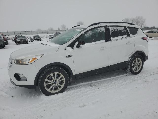 FORD ESCAPE SE 2018 with VIN 1FMCU9GD0JUA53642 - Photo from auction