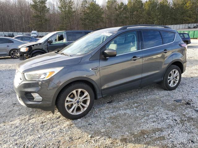 FORD ESCAPE SE 2018 with VIN 1FMCU0GD9JUB35641 - Photo from auction