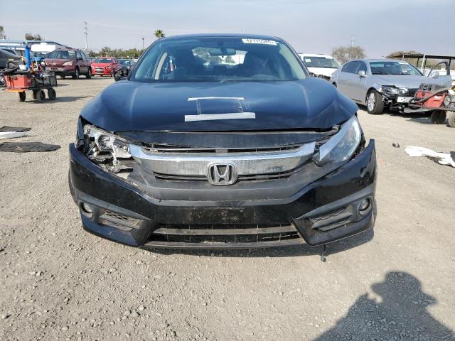 Photo 5 from auction – 2016 HONDA CIVIC EX with VIN 2HGFC1F35GH657330