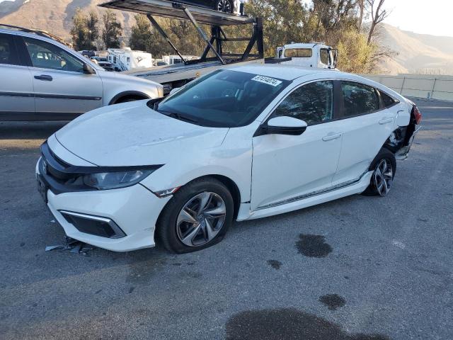 HONDA CIVIC LX 2020 with VIN 19XFC2F62LE200060 - Photo from auction