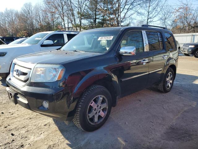 HONDA PILOT TOUR 2010 with VIN 5FNYF4H97AB005582 - Photo from auction
