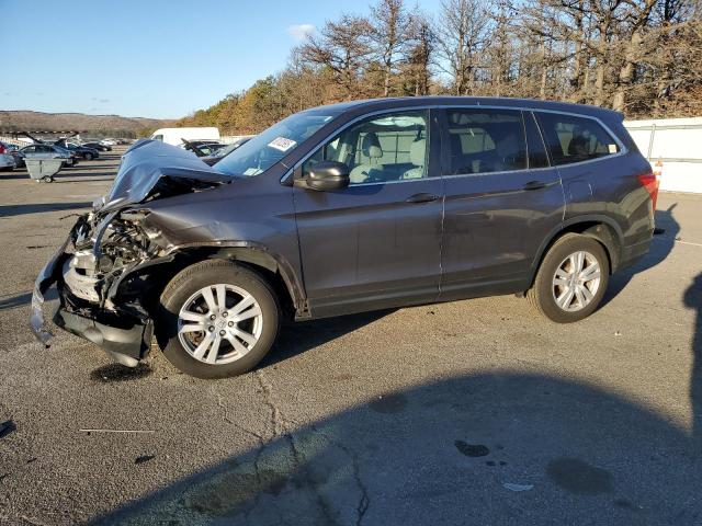 HONDA PILOT LX 2018 with VIN 5FNYF6H11JB044139 - Photo from auction