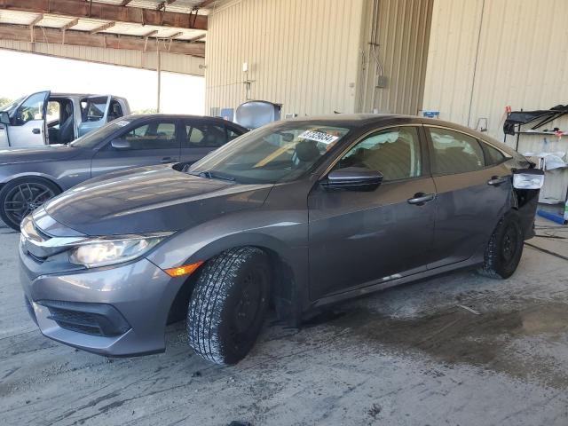 HONDA CIVIC LX 2017 with VIN 19XFC2F5XHE023028 - Photo from auction