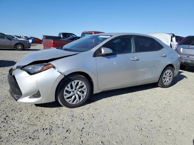 TOYOTA COROLLA L 2019 with VIN 5YFBURHE2KP881200 - Photo from auction