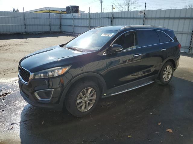 KIA SORENTO LX 2016 with VIN 5XYPG4A32GG063499 - Photo from auction