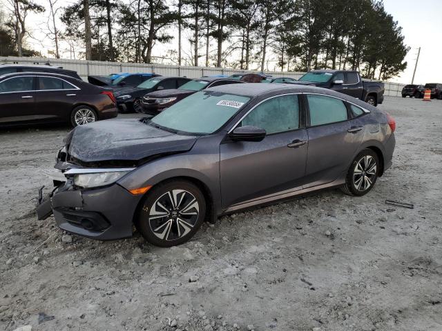 HONDA CIVIC EXL 2017 with VIN 19XFC1F74HE030584 - Photo from auction