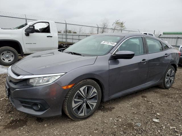 Photo 1 from auction – 2017 HONDA CIVIC EX with VIN 19XFC1F31HE008670
