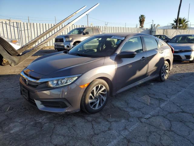 HONDA CIVIC EX 2018 with VIN 2HGFC2F75JH601467 - Photo from auction