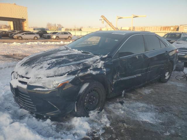 TOYOTA CAMRY LE 2017 with VIN 4T1BF1FKXHU618495 - Photo from auction