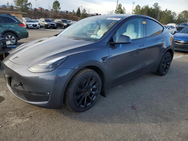 TESLA MODEL Y 2023 with VIN 7SAYGAEE0PF663768 - Photo from auction