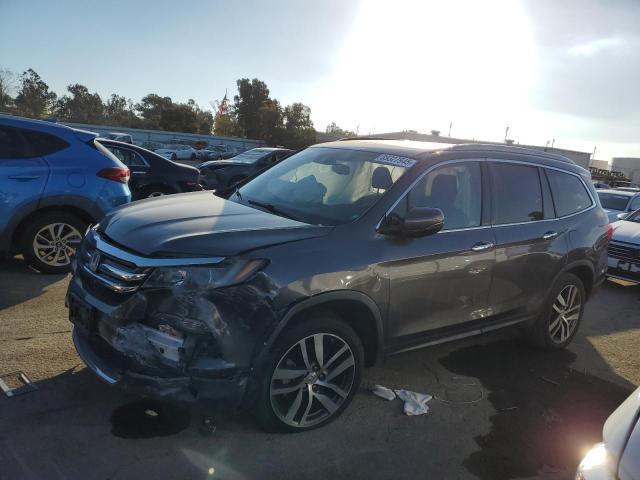 HONDA PILOT TOUR 2017 with VIN 5FNYF6H98HB095119 - Photo from auction