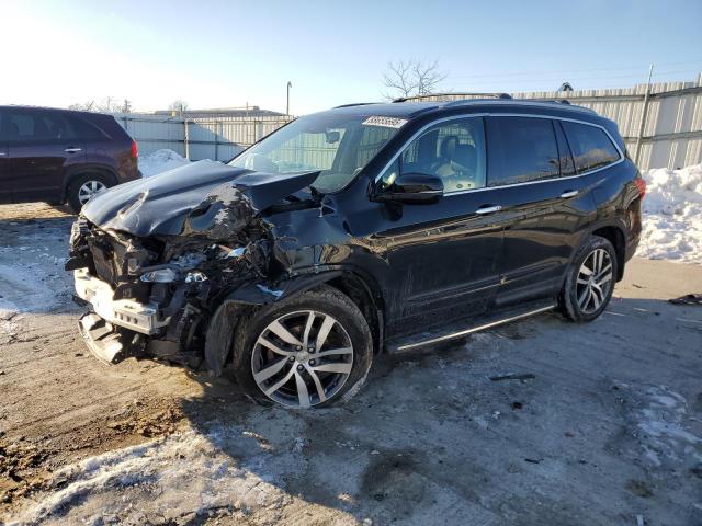 HONDA PILOT TOUR 2017 with VIN 5FNYF6H99HB003127 - Photo from auction