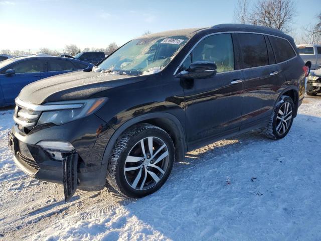 HONDA PILOT TOUR 2016 with VIN 5FNYF6H95GB507768 - Photo from auction