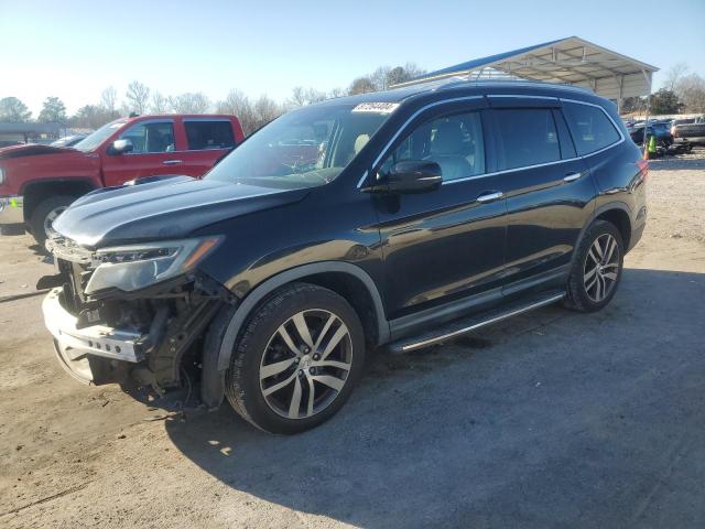 HONDA PILOT TOUR 2016 with VIN 5FNYF6H92GB030295 - Photo from auction