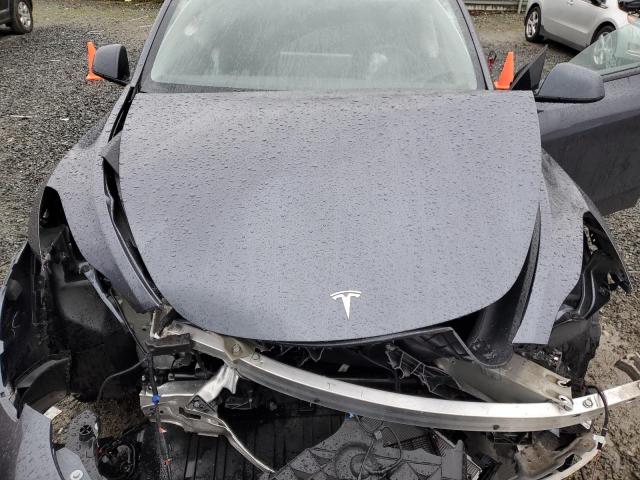 Photo 12 from auction – 2023 TESLA MODEL Y with VIN 7SAYGDEE0PF962033