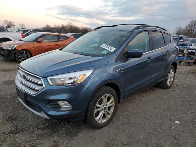 FORD ESCAPE SE 2018 with VIN 1FMCU9GD7JUC16321 - Photo from auction