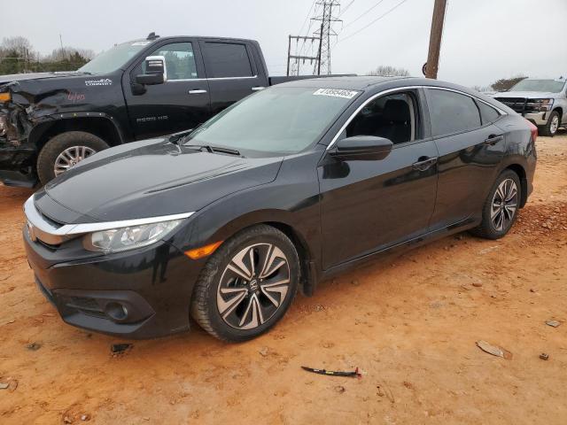 HONDA CIVIC EX 2018 with VIN JHMFC1F38JX016625 - Photo from auction
