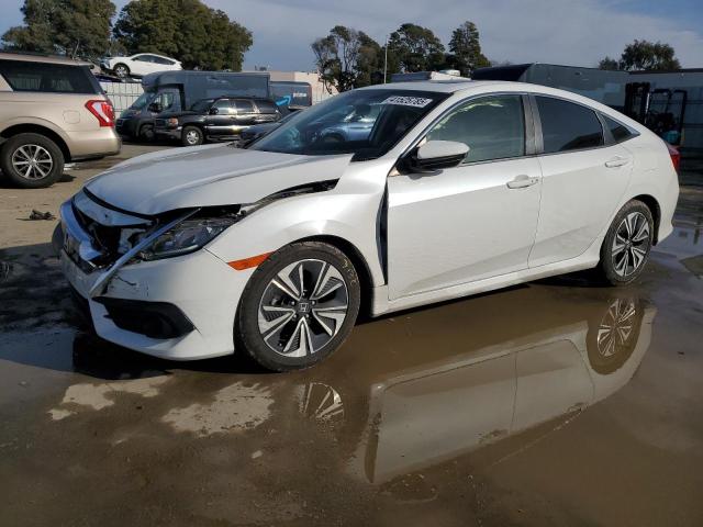 HONDA CIVIC EX 2018 with VIN JHMFC1F30JX021561 - Photo from auction