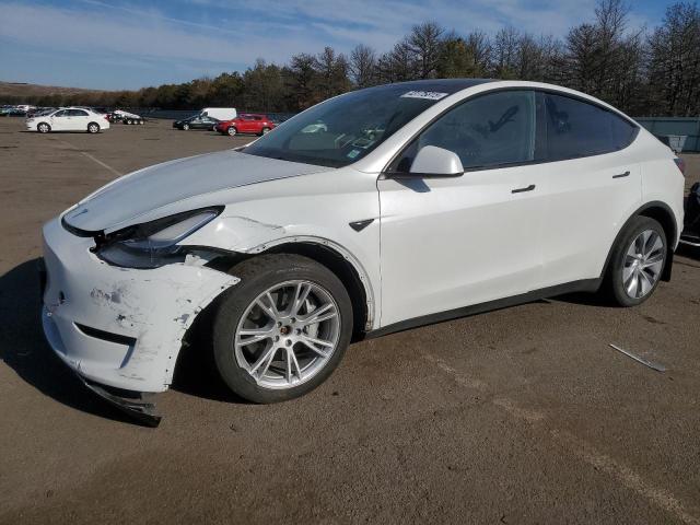 TESLA MODEL Y 2023 with VIN 7SAYGDEE1PA115700 - Photo from auction