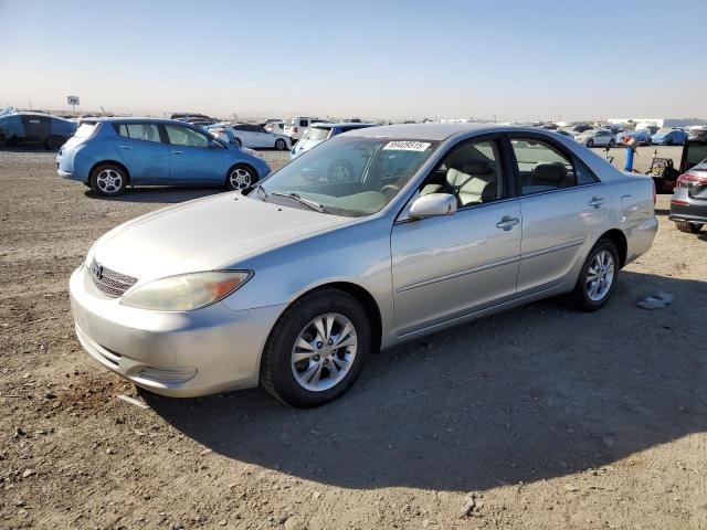 TOYOTA CAMRY LE 2004 with VIN 4T1BF32K74U574046 - Photo from auction