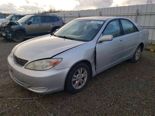 TOYOTA CAMRY LE 2004 with VIN 4T1BF30K84U586337 - Photo from auction