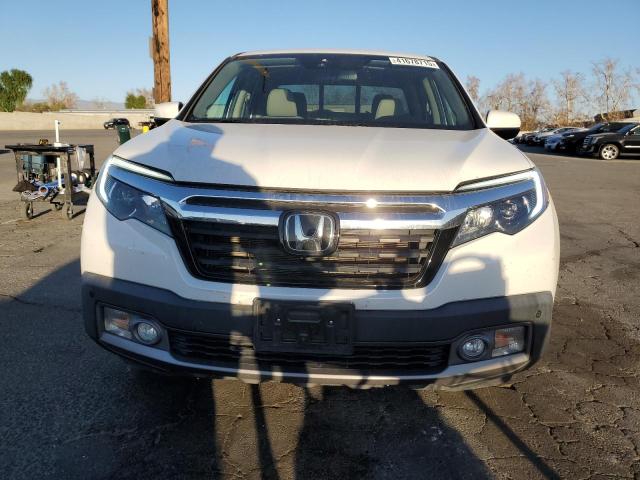 Photo 5 from auction – 2020 HONDA RIDGELINE with VIN 5FPYK3F76LB015571