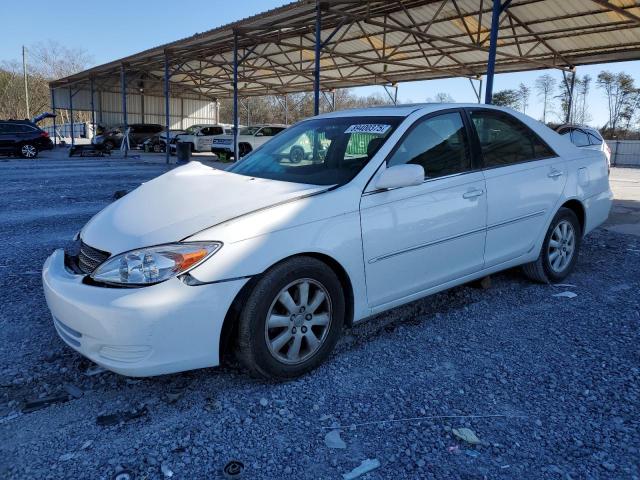 TOYOTA CAMRY LE 2002 with VIN 4T1BF30K32U006019 - Photo from auction