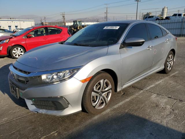 HONDA CIVIC LX 2018 with VIN 2HGFC2F57JH603316 - Photo from auction