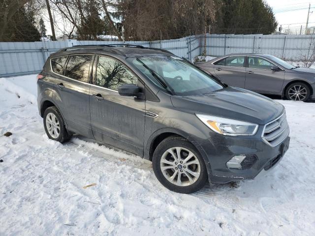 Photo 4 from auction – 2018 FORD ESCAPE SE with VIN 1FMCU0GD0JUD23948