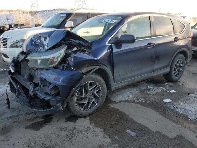 HONDA CR-V SE 2016 with VIN 5J6RM4H4XGL090335 - Photo from auction