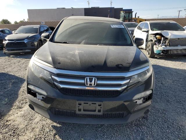 Photo 5 from auction – 2018 HONDA PILOT LX with VIN 5FNYF5H10JB022093