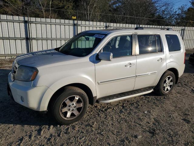 HONDA PILOT TOUR 2011 with VIN 5FNYF4H93BB083889 - Photo from auction