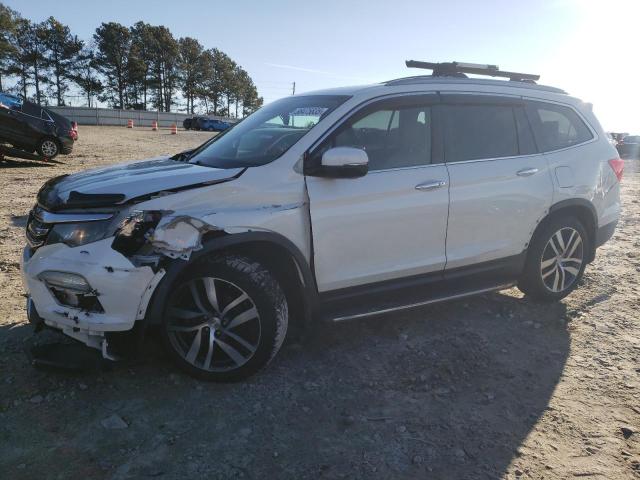 HONDA PILOT TOUR 2017 with VIN 5FNYF5H99HB016342 - Photo from auction
