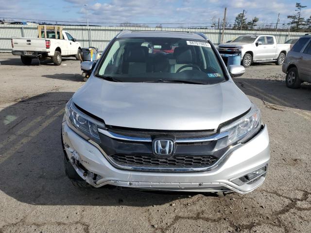 Photo 5 from auction – 2016 HONDA CRV with VIN 5J6RM4H97GL033151