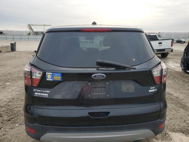 Photo 6 from auction – 2017 FORD ESCAPE SE with VIN 1FMCU9GD8HUD95561