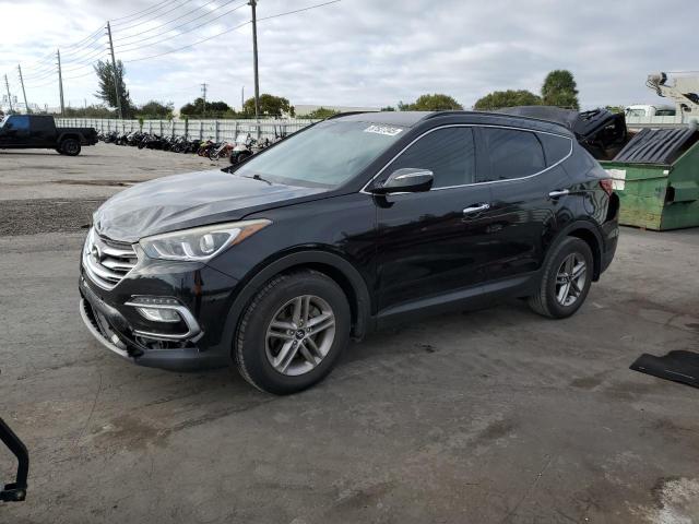 HYUNDAI SANTA FE S 2018 with VIN 5NMZU3LBXJH098837 - Photo from auction