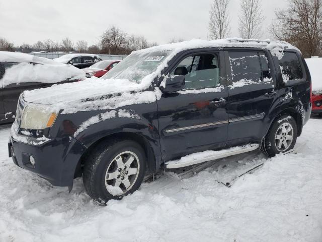 HONDA PILOT TOUR 2011 with VIN 5FNYF4H96BB015957 - Photo from auction