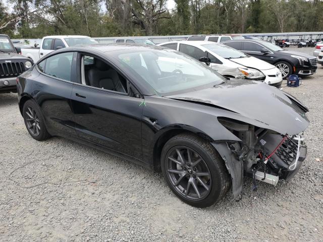 Photo 4 from auction – 2022 TESLA MODEL 3 with VIN 5YJ3E1EA9NF185325