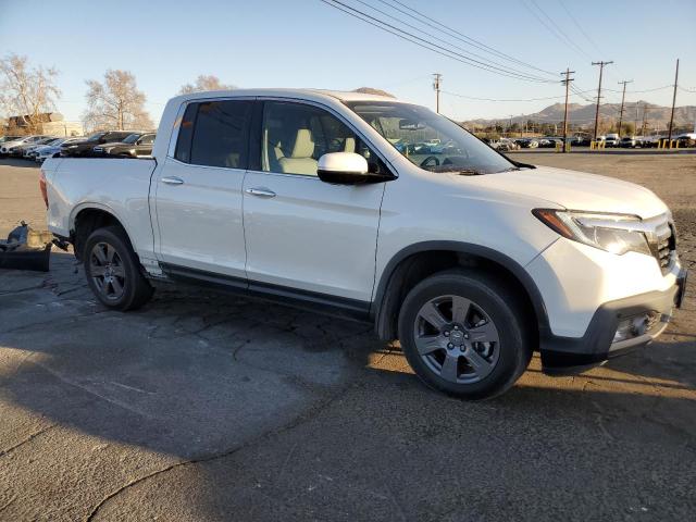 Photo 4 from auction – 2020 HONDA RIDGELINE with VIN 5FPYK3F76LB015571