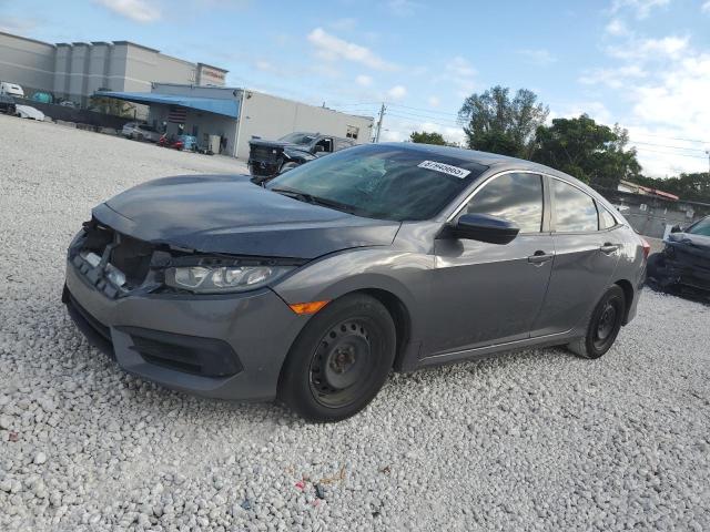 HONDA CIVIC LX 2018 with VIN 19XFC2F54JE204633 - Photo from auction