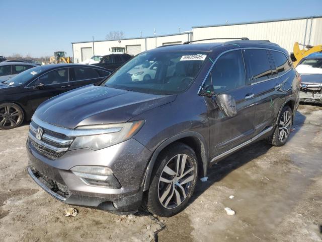 HONDA PILOT TOUR 2016 with VIN 5FNYF5H98GB017920 - Photo from auction