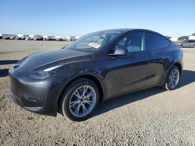 TESLA MODEL Y 2024 with VIN 7SAYGDED4RF017614 - Photo from auction