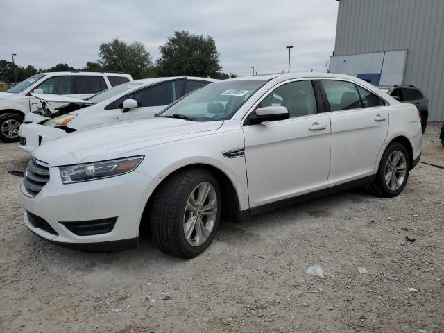 FORD TAURUS SEL 2015 with VIN 1FAHP2E8XFG161034 - Photo from auction