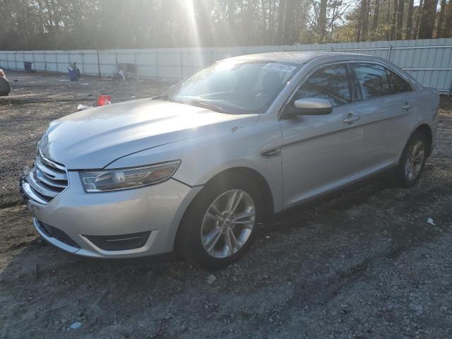 FORD TAURUS SEL 2013 with VIN 1FAHP2E8XDG164836 - Photo from auction