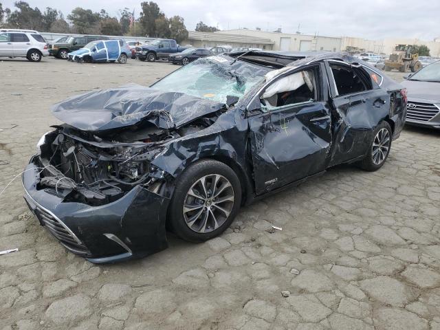 TOYOTA AVALON HYB 2016 with VIN 4T1BD1EB8GU051063 - Photo from auction