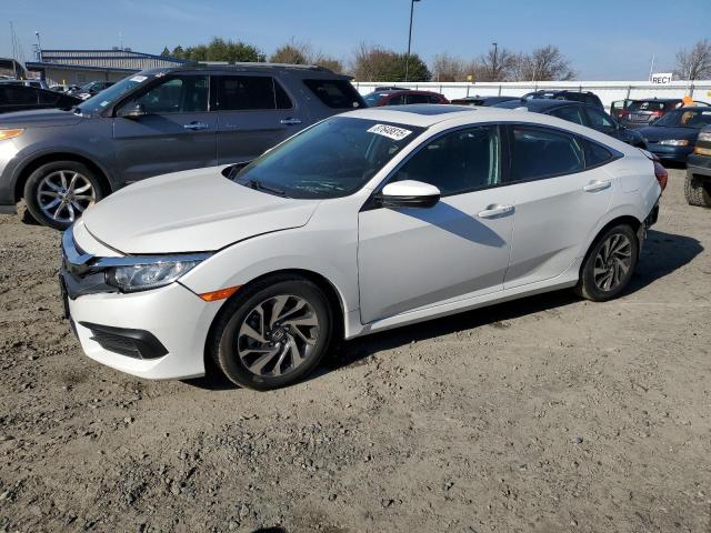HONDA CIVIC EX 2018 with VIN 19XFC2F76JE202366 - Photo from auction