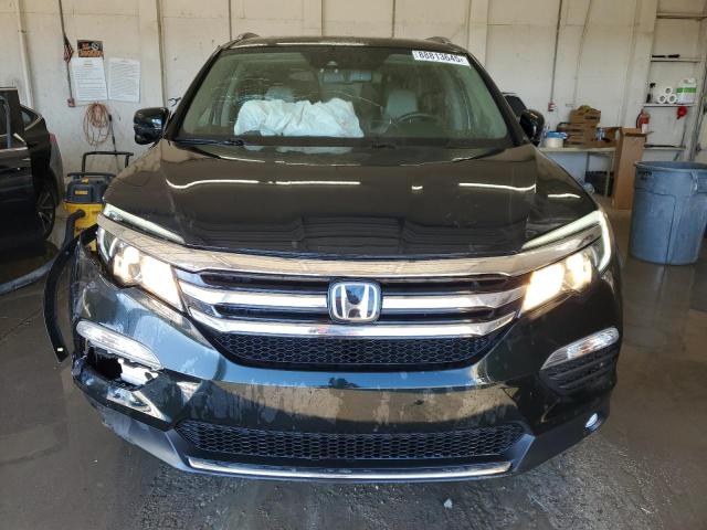 Photo 5 from auction – 2017 HONDA PILOT TOUR with VIN 5FNYF6H90HB057304