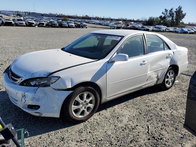 TOYOTA CAMRY LE 2004 with VIN JTDBE30K740283371 - Photo from auction
